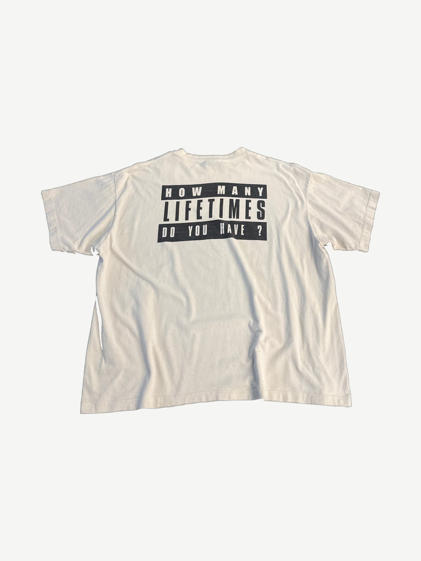 Saint Michael Denim Tears Live Crew tee back in cream cotton with stark printed text and soft worn finish