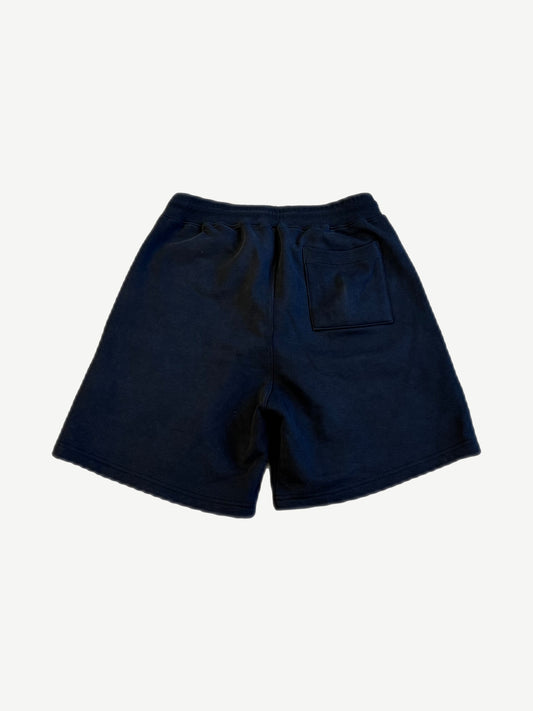 Satoshi Nakamoto navy studded shorts back view with rear patch pocket and elastic ribbed waistband.