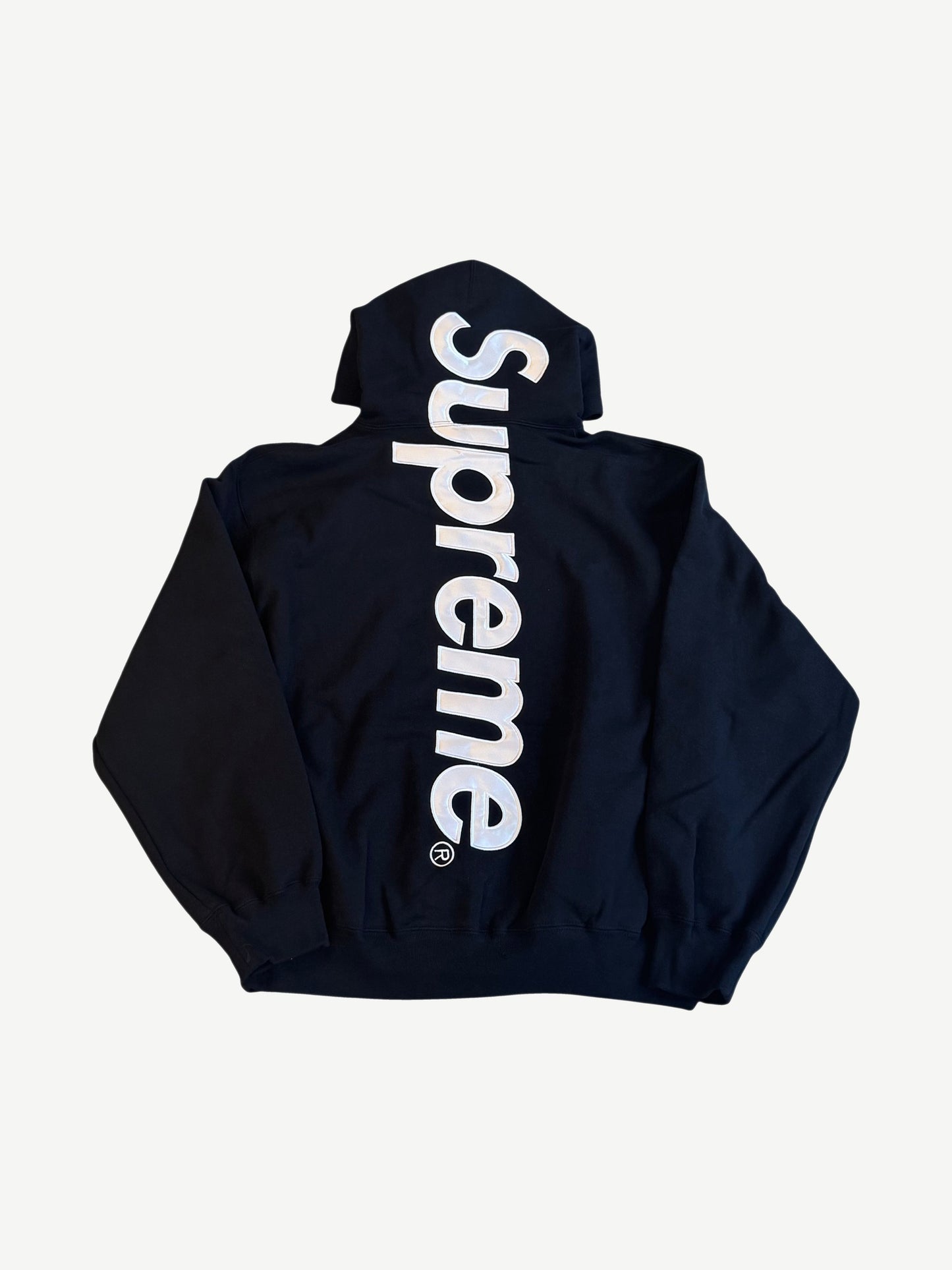 Supreme black satin applique hoodie back with large vertical Supreme satin patch logo down center spine.
