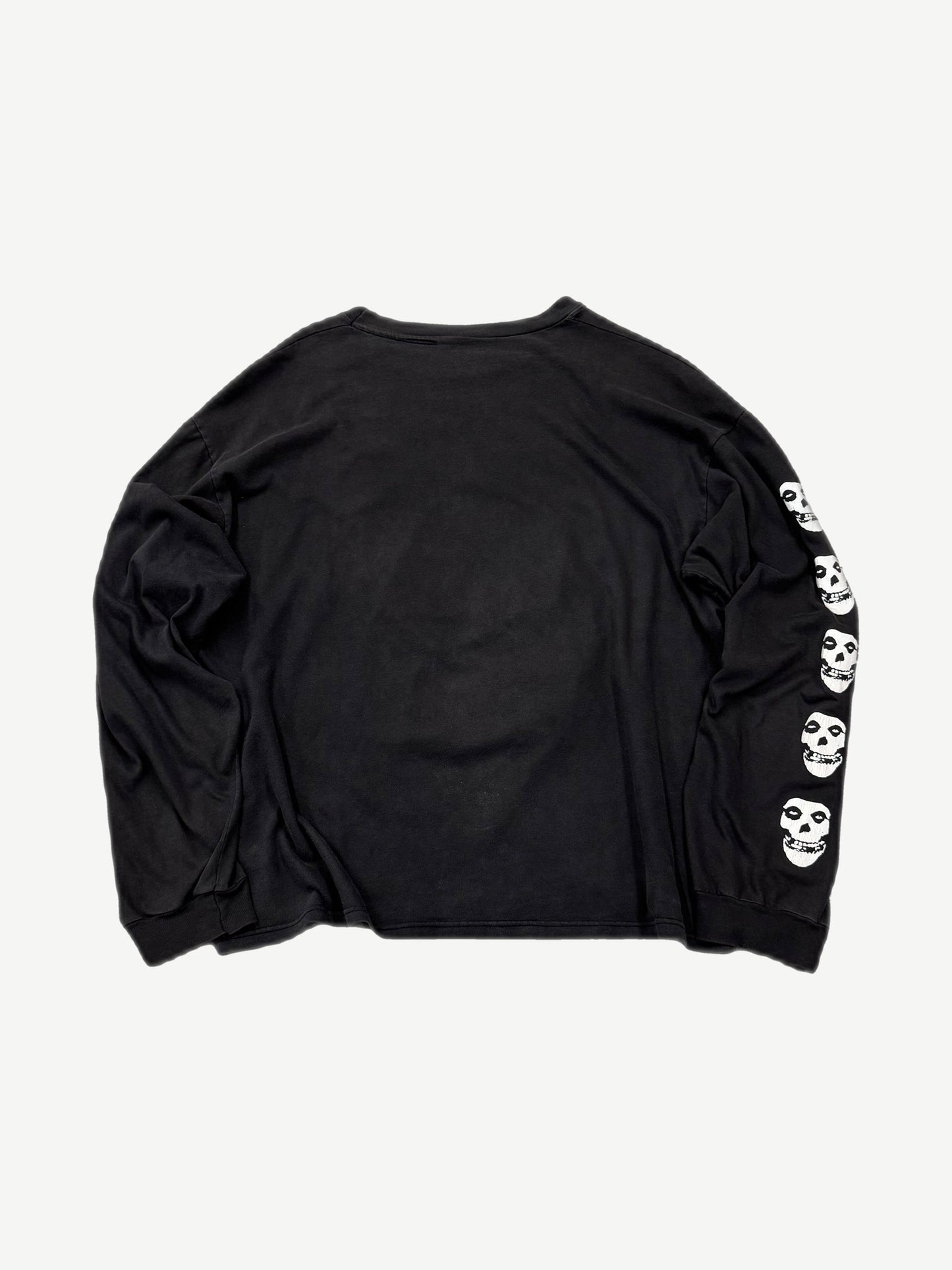 Vintage Misfits black longsleeve back view with white Crimson Ghost skull repeats down right sleeve
