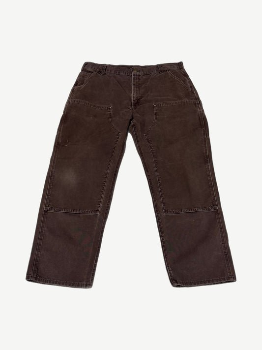 Vintage brown Carhartt double-knee canvas pants back view with hammer loop and patch rear pockets.