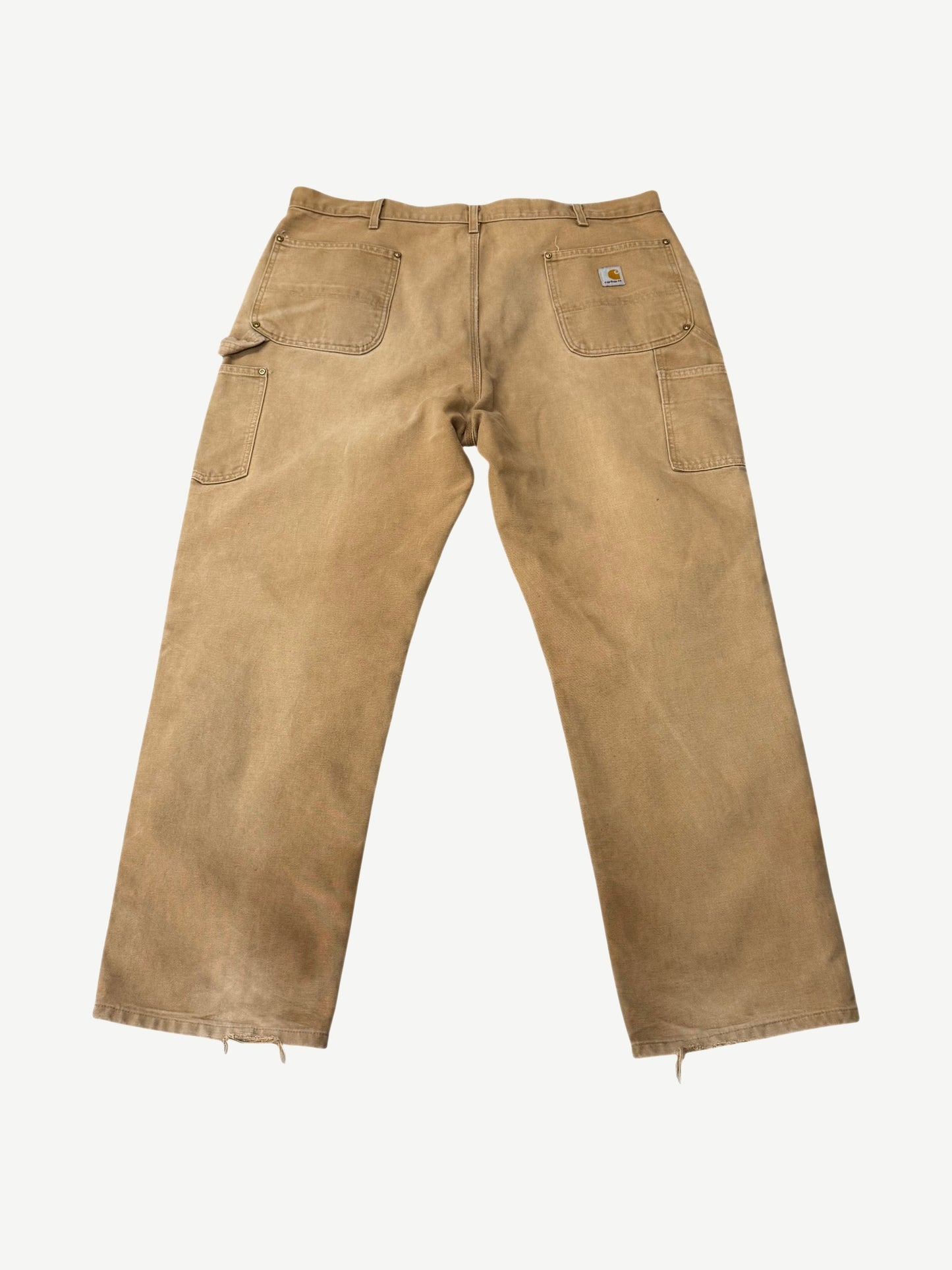 Vintage Carhartt tan carpenter pants back view showing utility pockets, hammer loop and Carhartt label