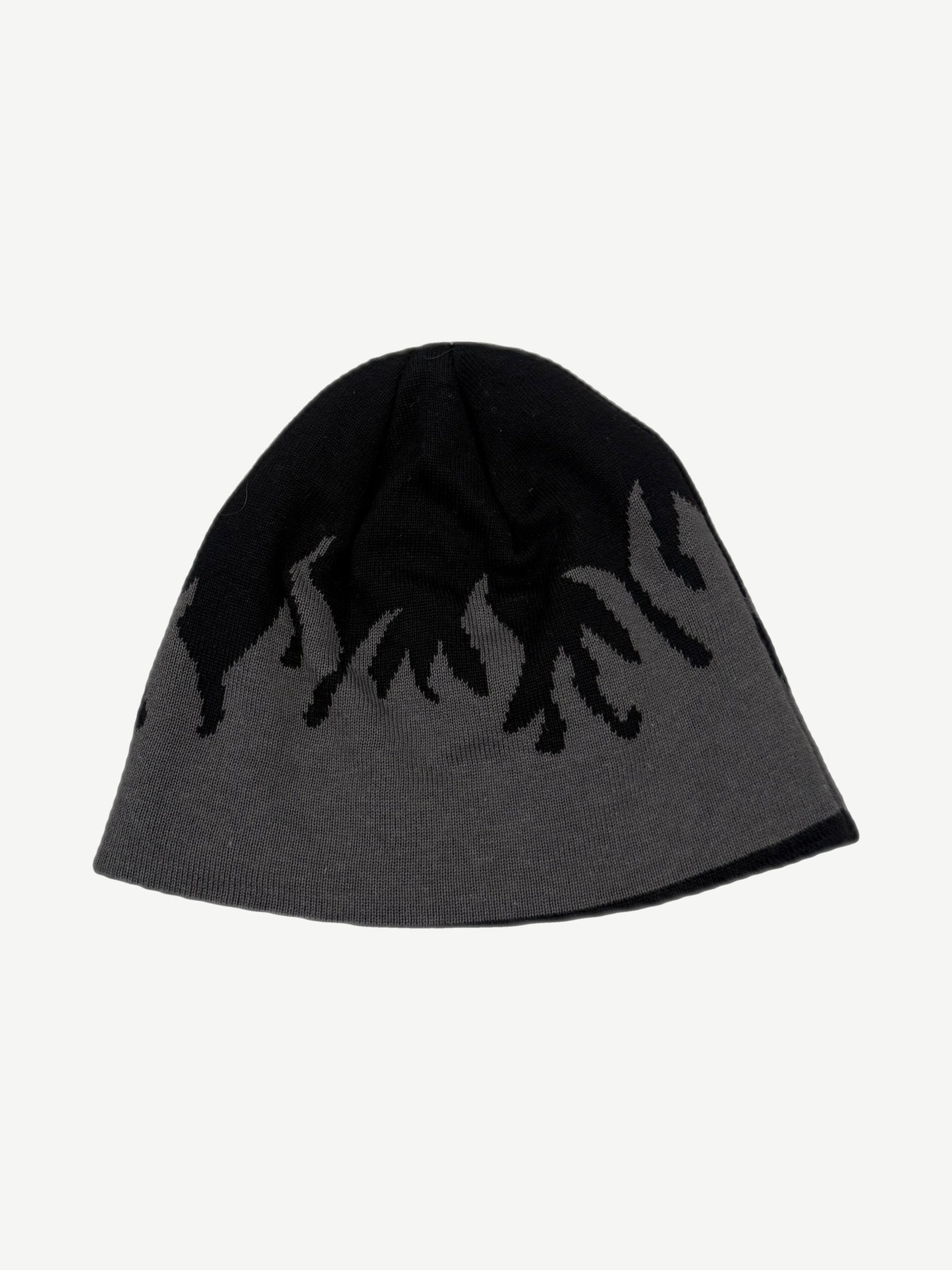 Reverse side of vintage Harley-Davidson beanie showing gray base with black flame knit pattern detail