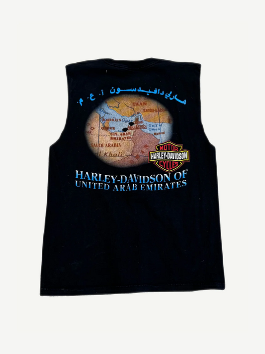 Back of vintage Harley Davidson UAE cutoff tee showing dealership graphic and raw cut sleeves.