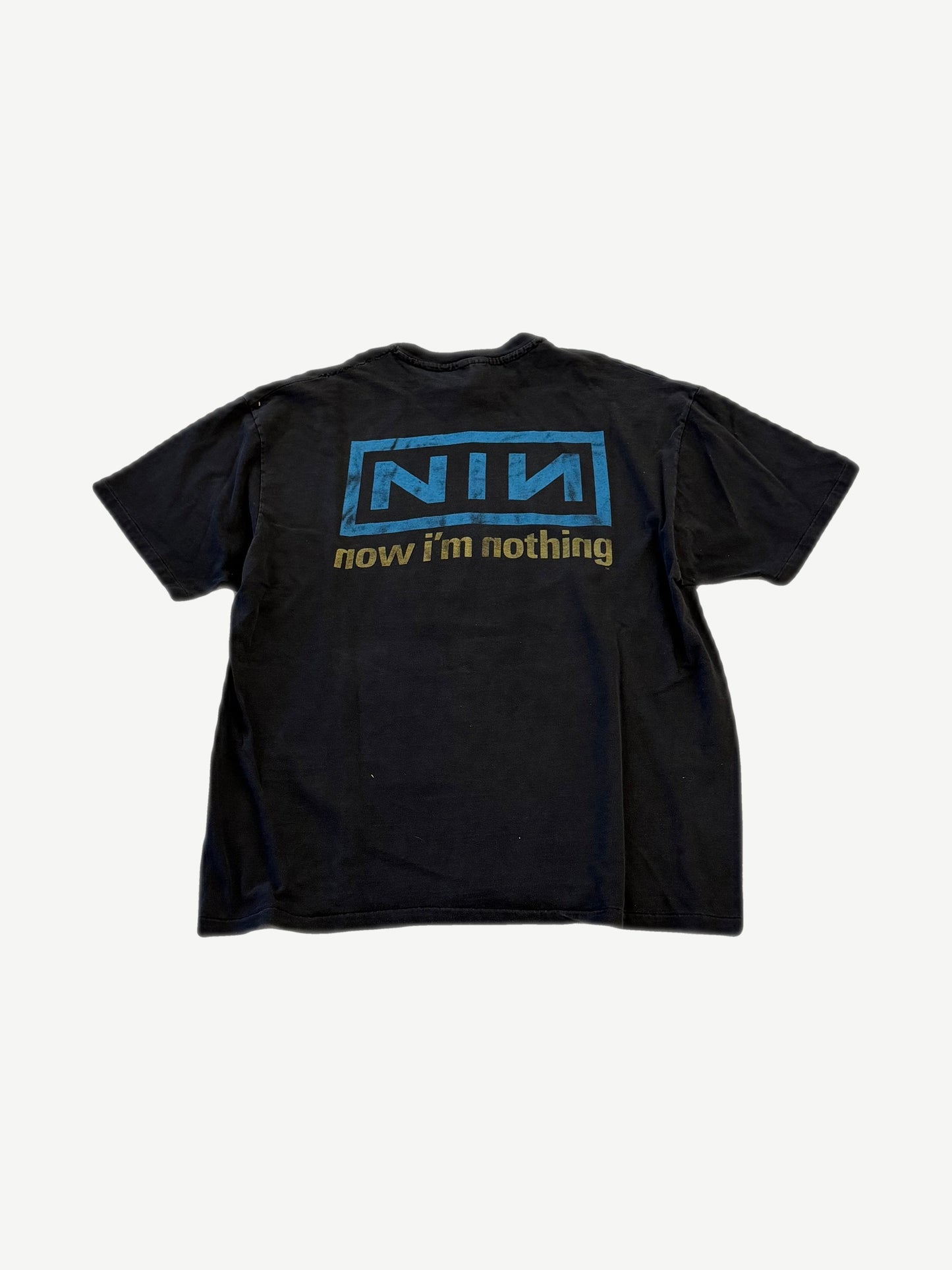 Back of vintage Nine Inch Nails tee with boxed NIN logo and Now I'm Nothing text in blue and gold.