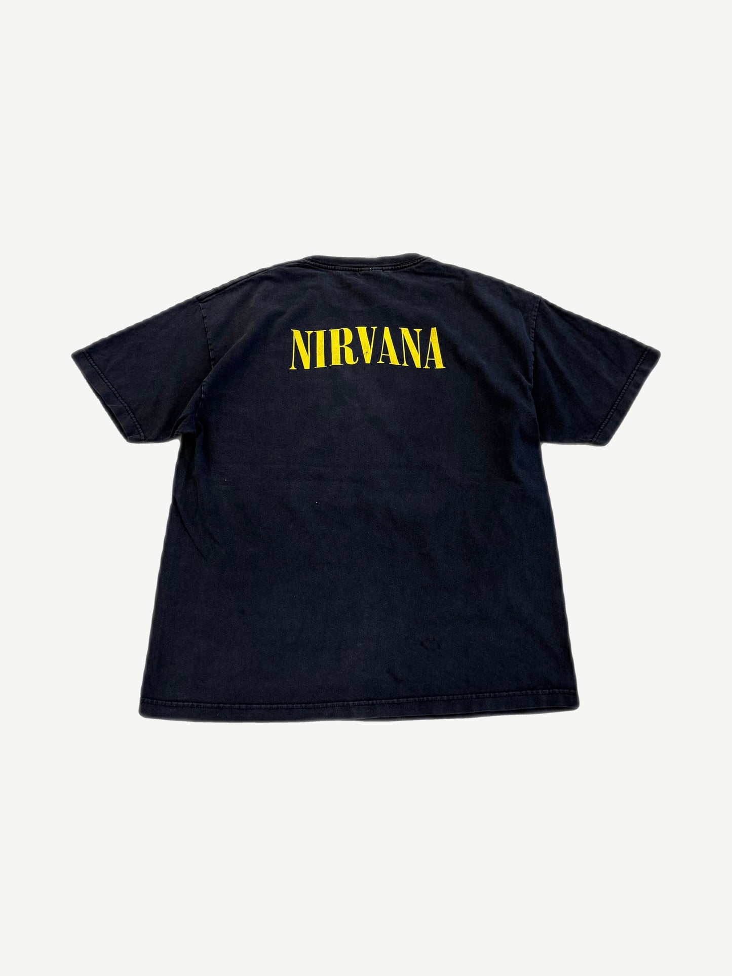 Vintage Nirvana black band tee back with yellow stencil Nirvana logo across upper shoulders.
