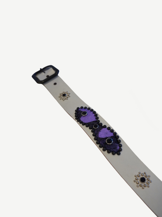 Vintage white studded belt strap detail with purple suede patch, black bead trim and silver concho rivets