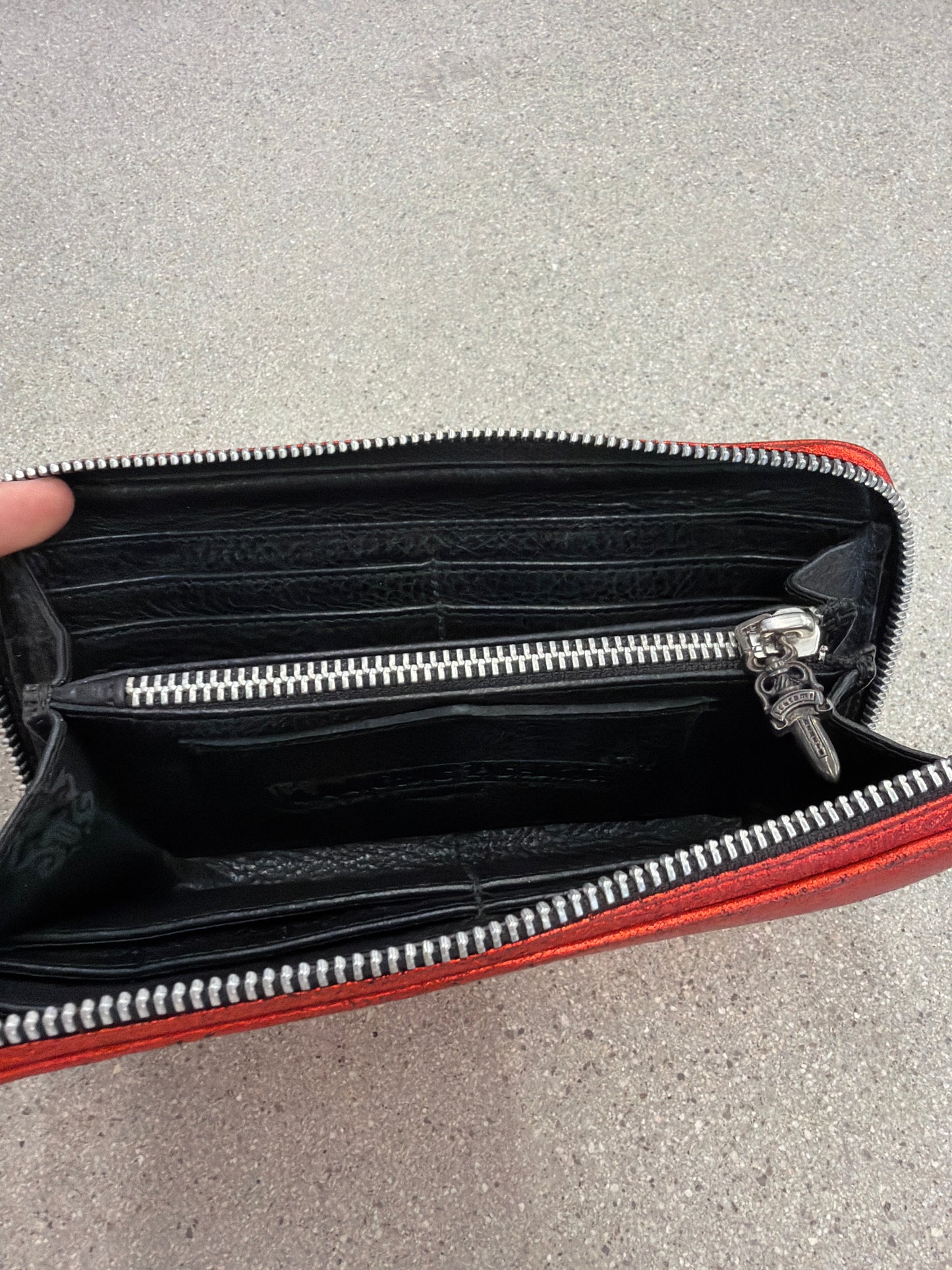 Chrome Hearts red long wallet interior view showing black leather card slots and zip coin pocket