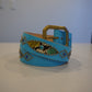 Vintage light blue leather belt with brass buckle, snakeskin inlay panels and silver studs around blue gem
