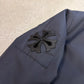 Chrome Hearts black Cobra racing jacket sleeve detail showing black leather Maltese cross patch