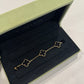 Van Cleef & Arpels Alhambra bracelet detail view showing onyx clover motif and 18k gold bead setting
