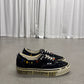 Satoshi Nakamoto x Vans Era black canvas low-top sneakers with rhinestone collar studs, side view