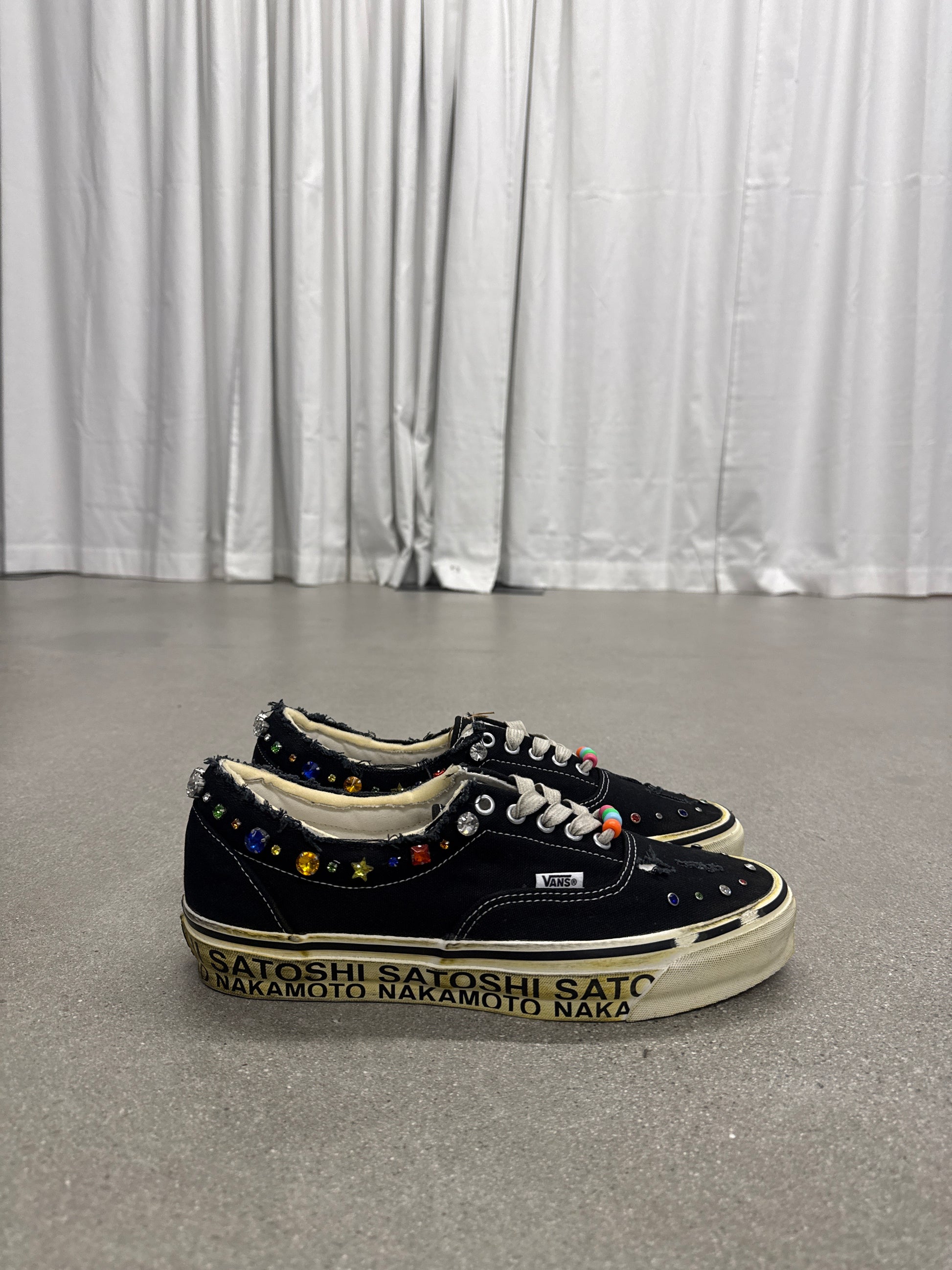 Satoshi Nakamoto x Vans Era black canvas low-top sneakers with rhinestone collar studs, side view