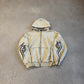 Balenciaga cream hooded zipup with black tribal flame graphics on sleeves and distressed sun-faded finish