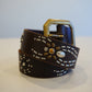 Vintage brown leather belt coiled with silver studded spider motif, amber gem and antique brass buckle
