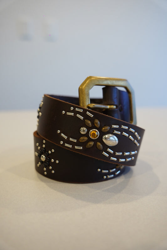 Vintage brown leather belt coiled with silver studded spider motif, amber gem and antique brass buckle