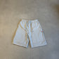 Supreme grey double knee painter sweat shorts front, utility pockets and red Supreme tab detail