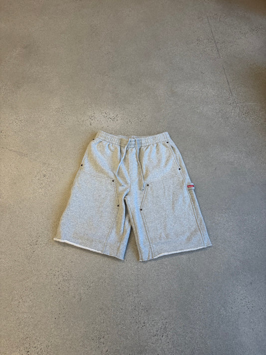 Supreme grey double knee painter sweat shorts front, utility pockets and red Supreme tab detail