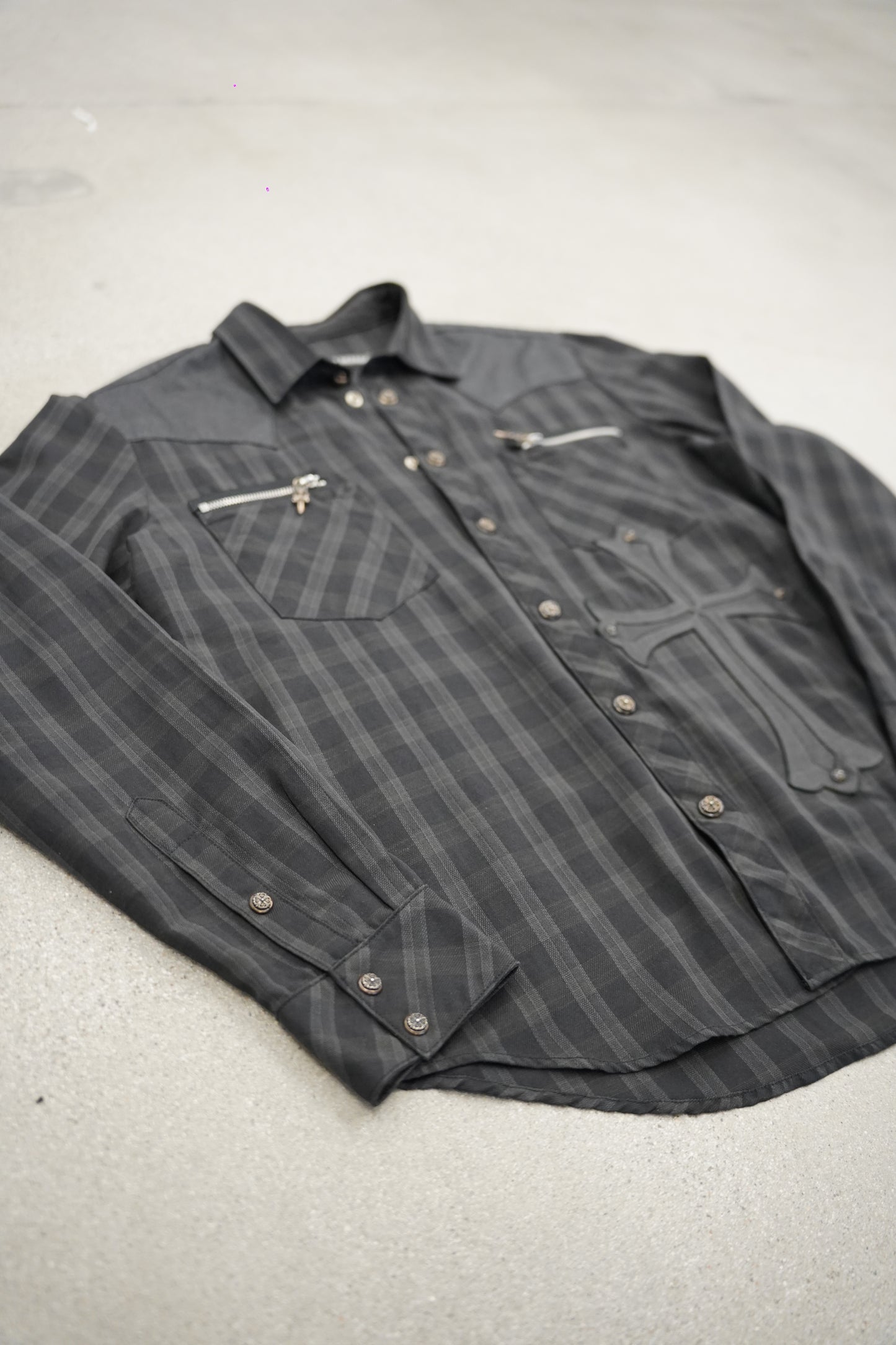 Chrome Hearts grey plaid flannel angled view showing zipper chest pockets and leather cross applique