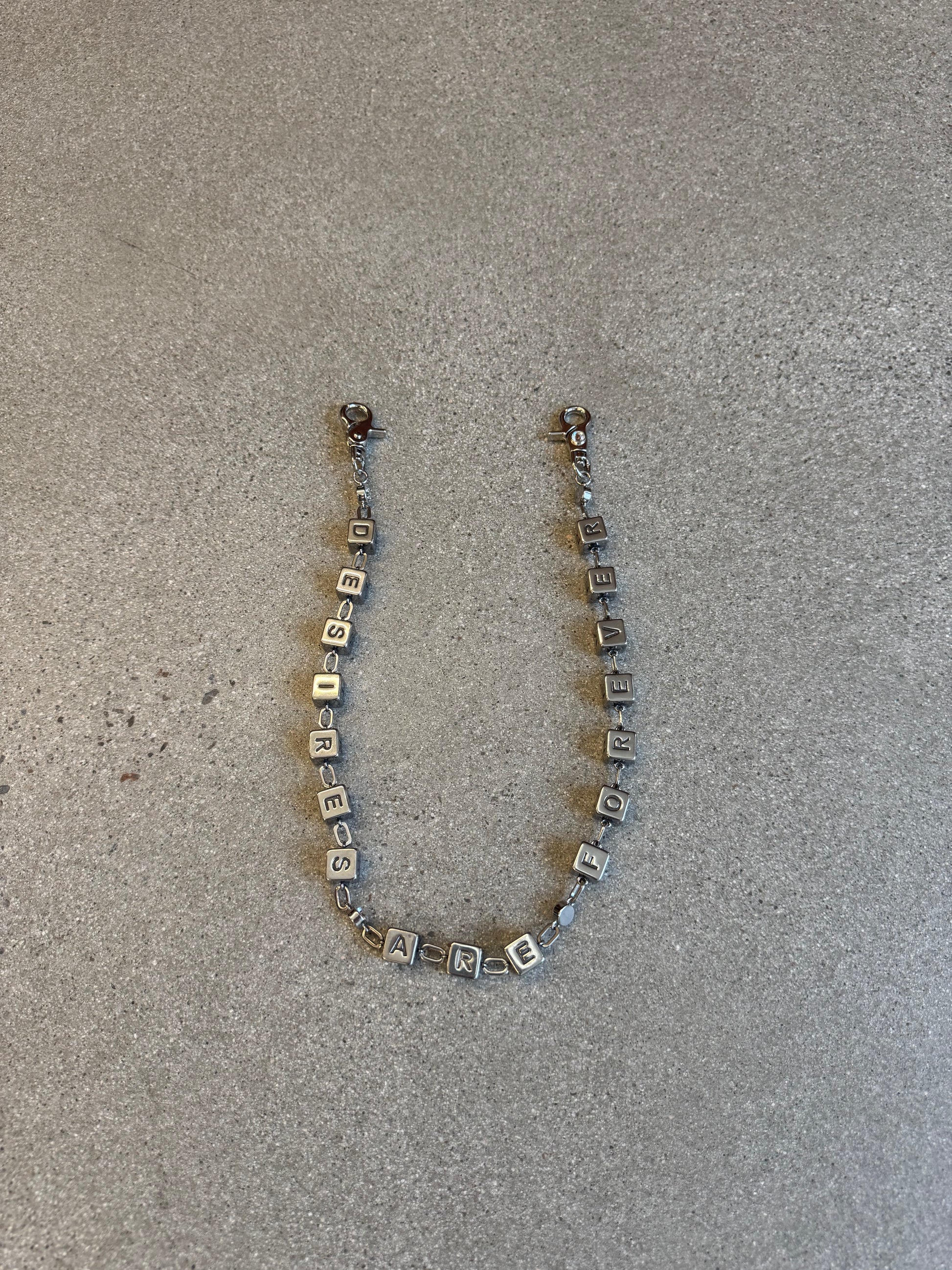 Bottega Desires silver Dice Game wallet chain with engraved cube letter beads spelling out across the chain