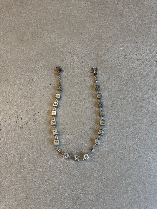 Bottega Desires silver Dice Game wallet chain with engraved cube letter beads spelling out across the chain