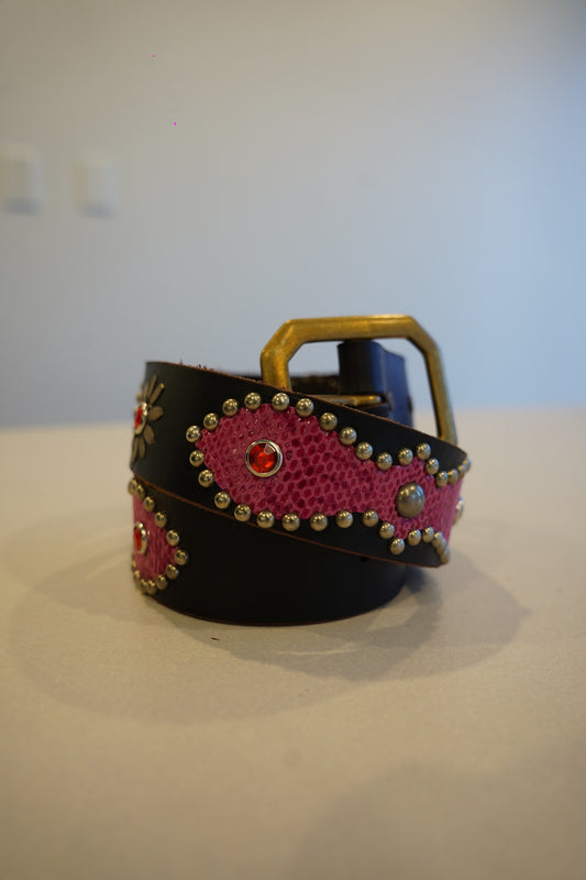 Vintage black leather belt with pink snakeskin inlays, silver studs, red gemstones and brass buckle.