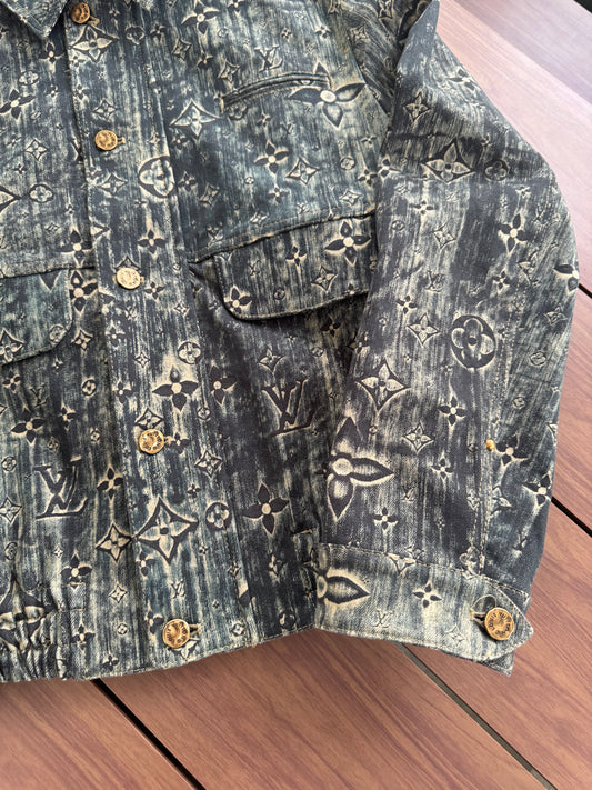 Louis Vuitton blue monogram denim jacket detail view highlighting embossed LV stars across denim.