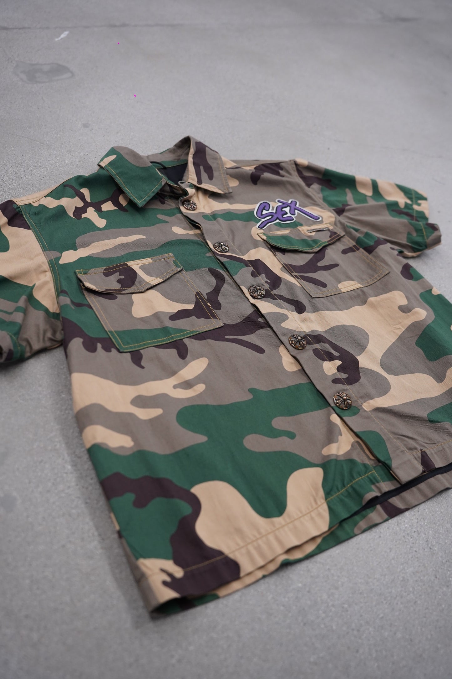Chrome Hearts Matty Boy Sex Records camo button-up detail shot, faded green camo cotton with chest pocket.
