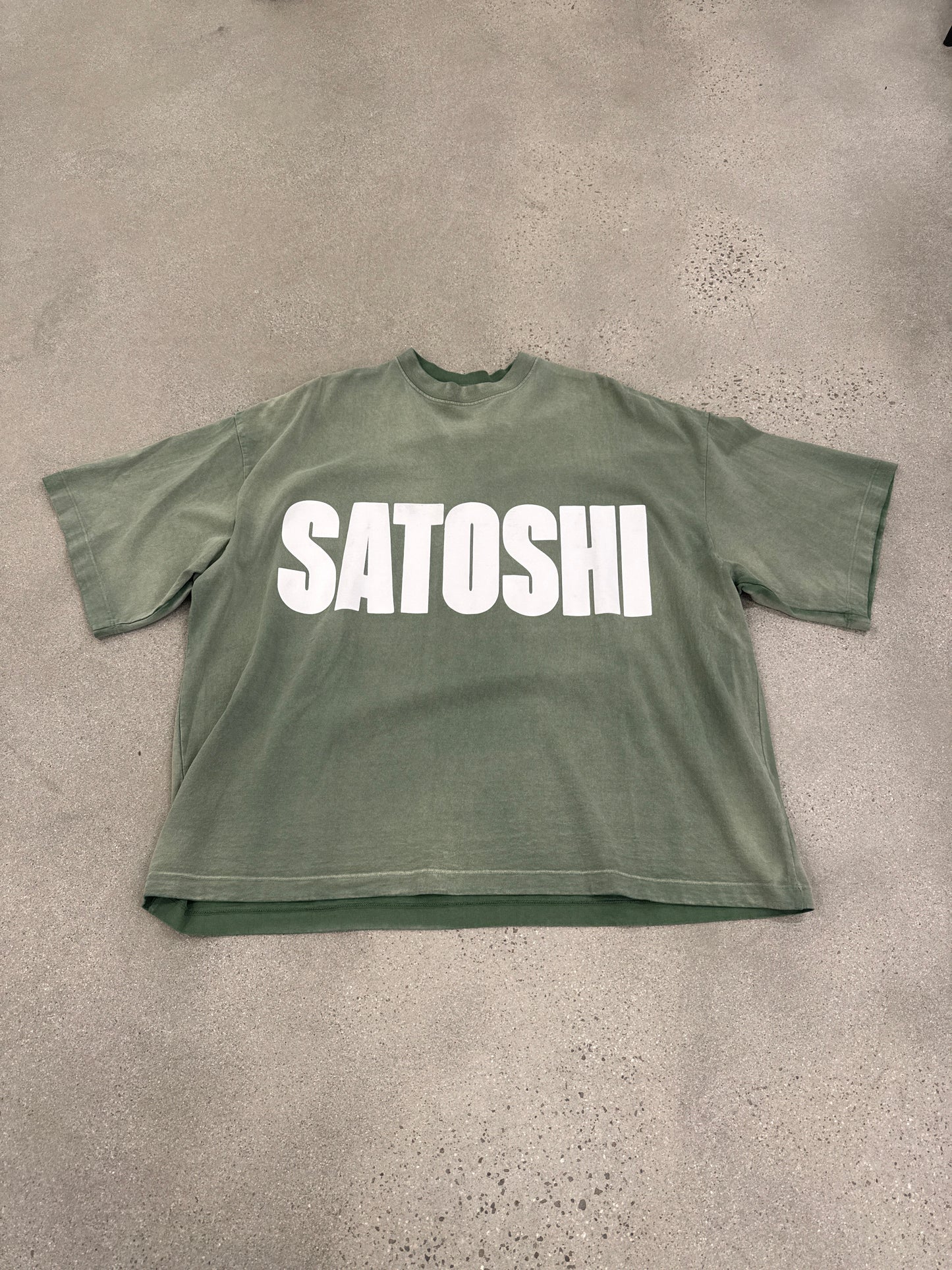 Satoshi Nakamoto green oversized impact logo tee front with bold white SATOSHI block lettering