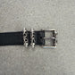 Chrome Hearts Celtic Roller belt buckle detail showing engraved silver dagger keepers on black leather