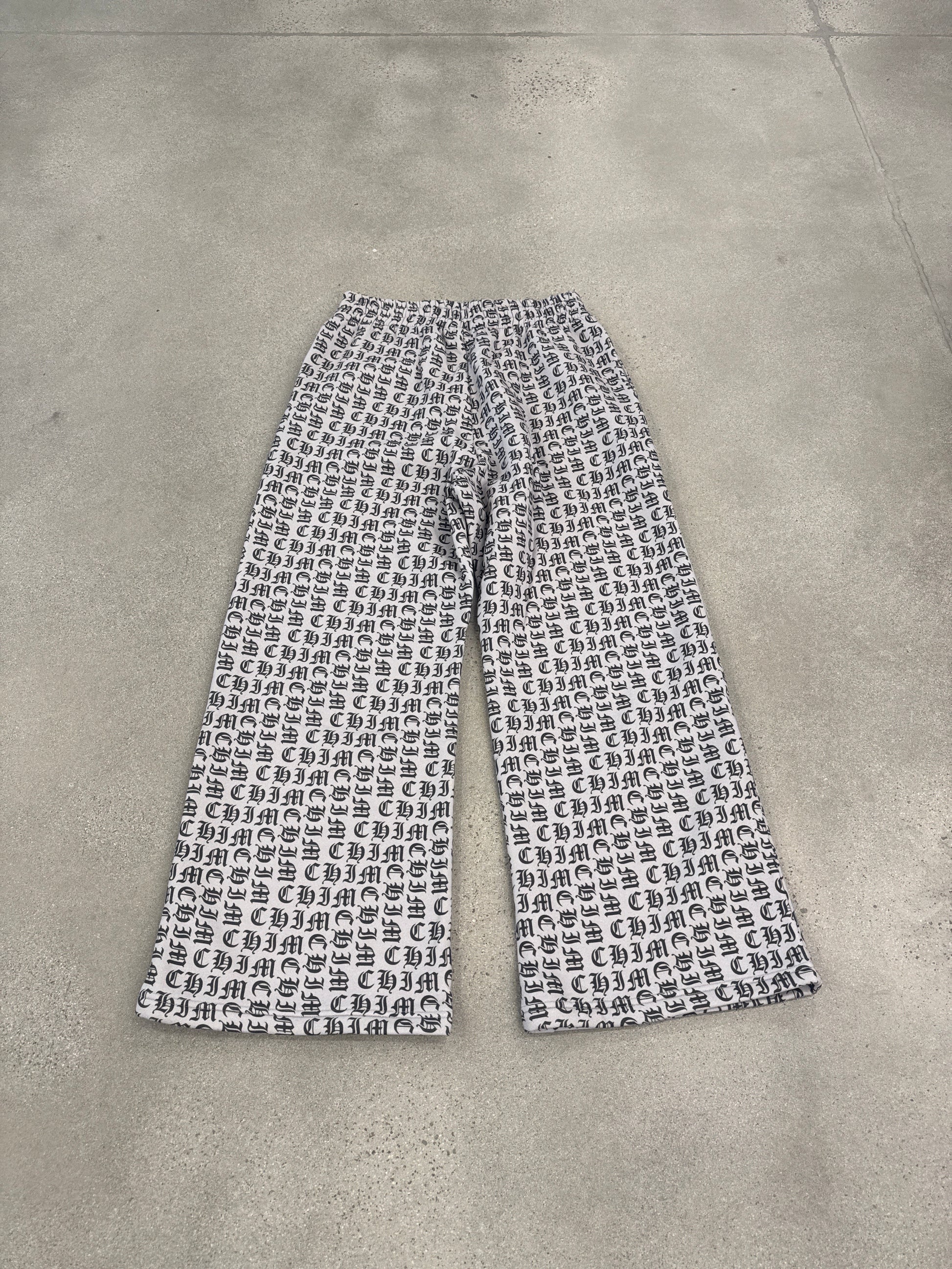 HMDD Happy Memories Don't Die sweatpants detail in black with bold white Old English graphic print