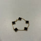 Van Cleef & Arpels 18k gold Alhambra bracelet with 5 black onyx clover motifs and gold bead trim