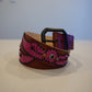 Vintage brown pink snakeskin leather belt coiled with silver studded wing buckle hardware.