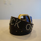 Vintage black leather studded belt coiled with brass buckle and silver stud lettering across the strap