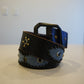 Vintage black denim leather belt with silver pyramid studs running along full length and chrome buckle.