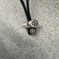 Chrome Hearts black fleece hoodie detail, close-up of horseshoe logo embroidery on shaggy fabric