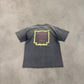 Back of vintage Pink Floyd tee on concrete showing World Tour 1994 print and overall faded vintage wash