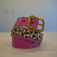 Vintage pink studded leather belt coiled, animal print panel with silver pyramid stud detail
