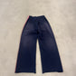 Rear view of Happy Memories Don't Die navy track pants showing red striping and wide straight-leg silhouette