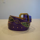 Vintage purple leather belt coiled with brass buckle, snakeskin medallion inlays and gemstone studs