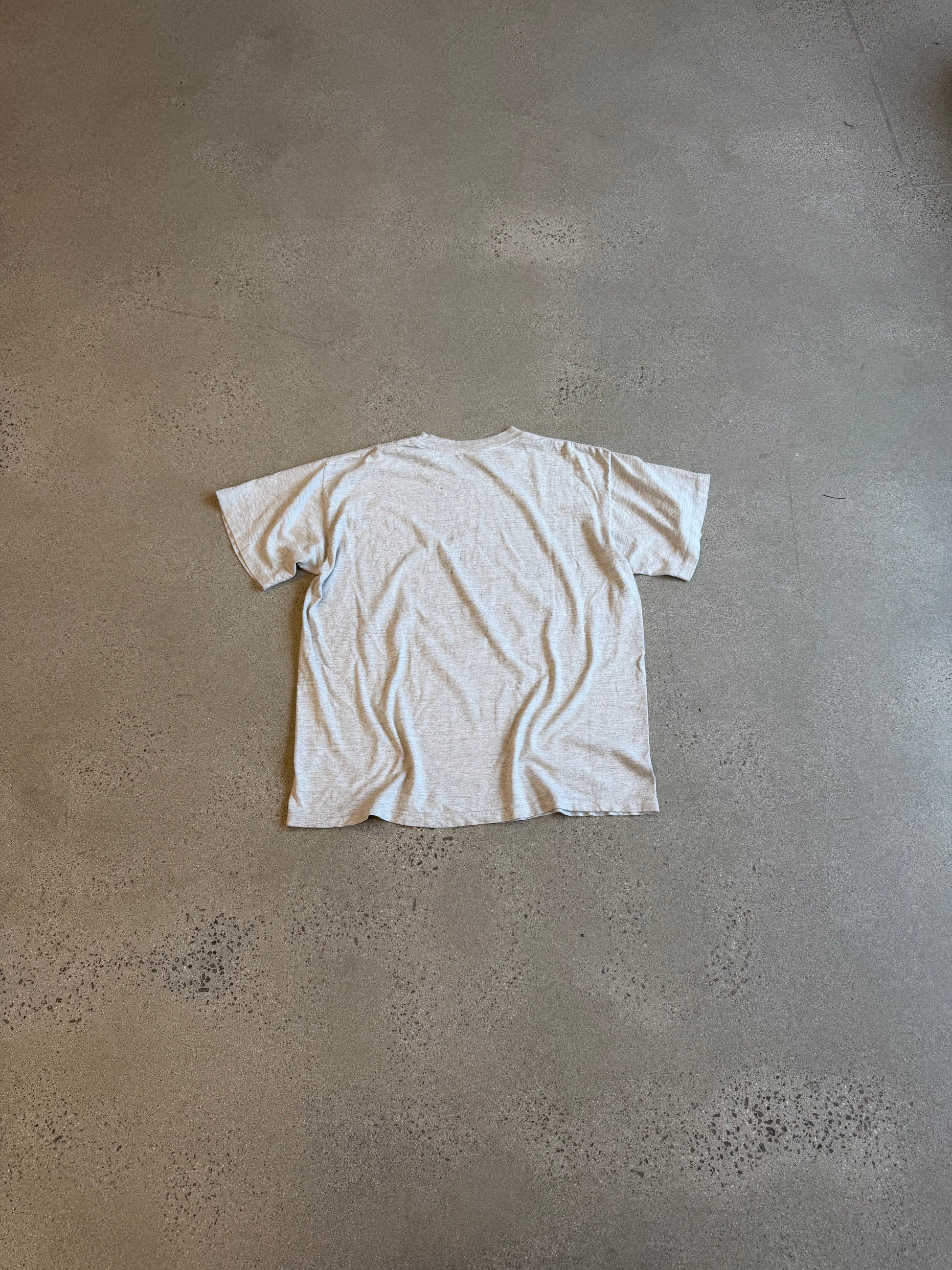 Vintage Betty Boop heathered cream tee back blank cotton view laid on concrete floor