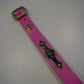 Pink snakeskin studded belt, close detail of textured scale grain and metal pyramid studs