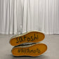 Satoshi Nakamoto Vans Era, sole view with orange gum sole and handwritten marker signature
