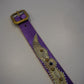 Vintage purple studded belt laid flat showing brass buckle, snakeskin wing detail and beaded silver edging
