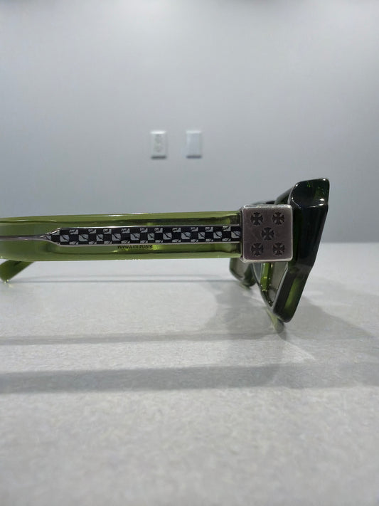 Chrome Hearts Matty Boy green sunglasses temple detail showing silver cross hardware and Made in Japan stamp