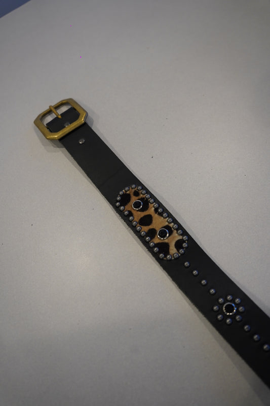 Vintage studded black leather belt detail with cheetah print calf hair inset and silver rivet trim
