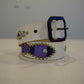 Vintage white leather belt coiled with purple ponyhair inlays, silver studs, blue rhinestones and black square buckle