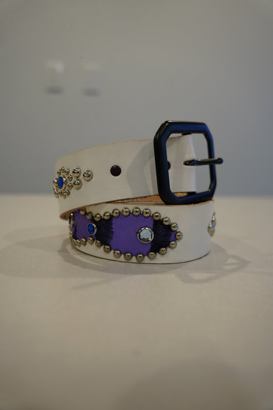 Vintage white leather belt coiled with purple ponyhair inlays, silver studs, blue rhinestones and black square buckle