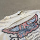 Aerosmith Nine Lives vintage tour tee detail showing faded graphic print and worn black cotton fabric.