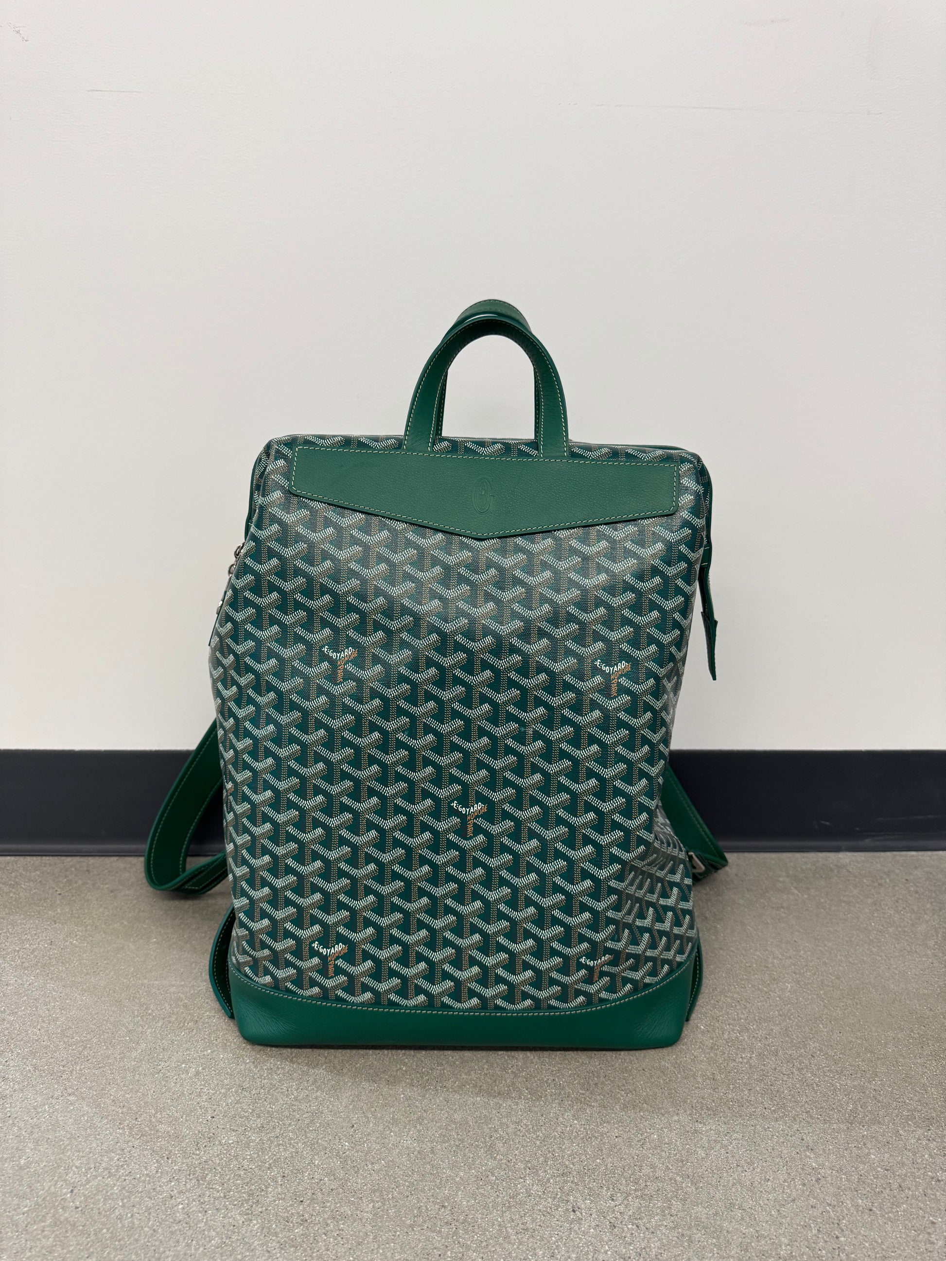 Goyard Cisalpin backpack in green Goyardine canvas with chevron print, green leather trim and top handle.
